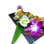 A plate of sushi with a purple flower on it.